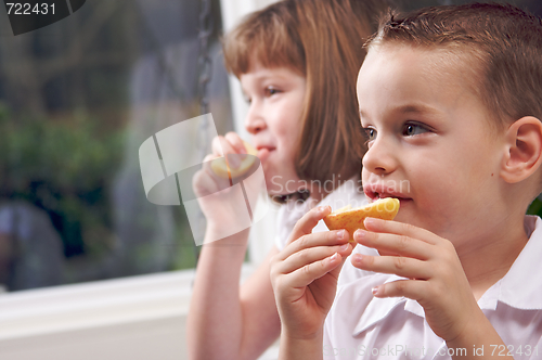 Image of Sister and Brother Eating an Apple