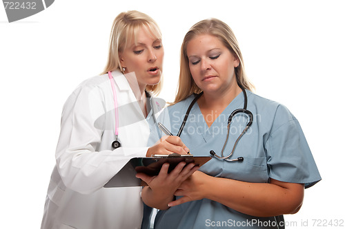 Image of Two Doctors or Nurses Looking of File on Clipboard
