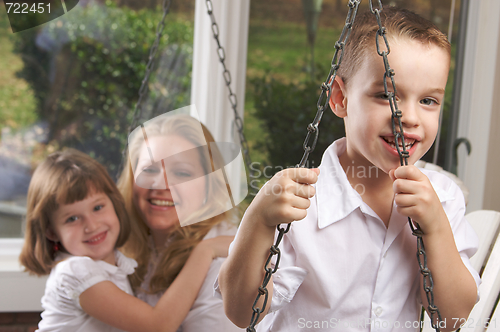 Image of Young Boy Poses with Mom and Sister