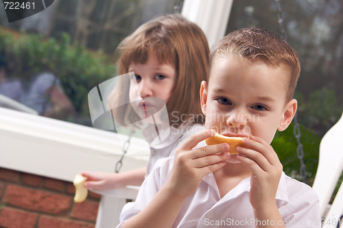 Image of Sister and Brother Eating an Apple