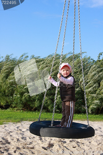 Image of  girl on a swing