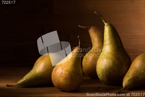 Image of composition of pears on wooden table