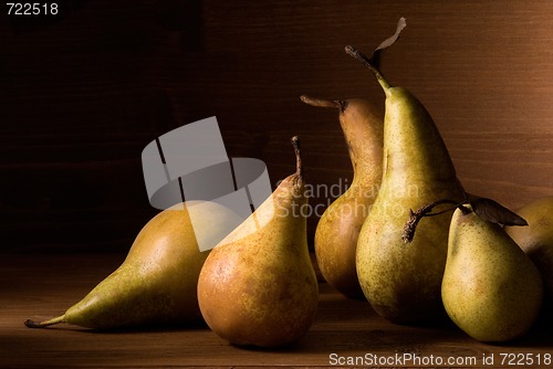 Image of composition of pears on wooden table