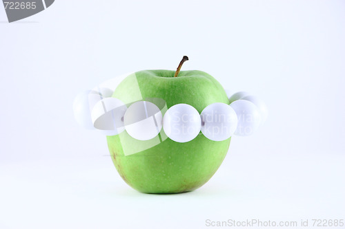 Image of Green apple with a white beads
