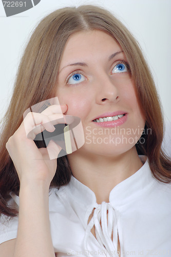 Image of The smiling girl with a mobile phone