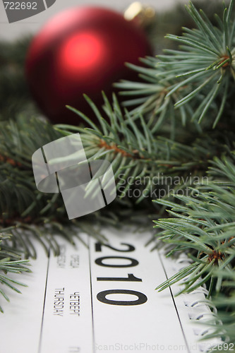 Image of Calendar for 2010 covered with fur-tree branches