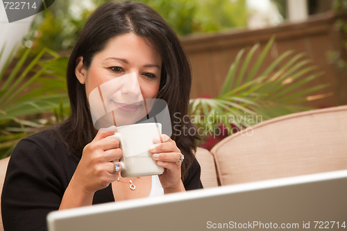 Image of Hispanic Woman with Coffee and Laptop