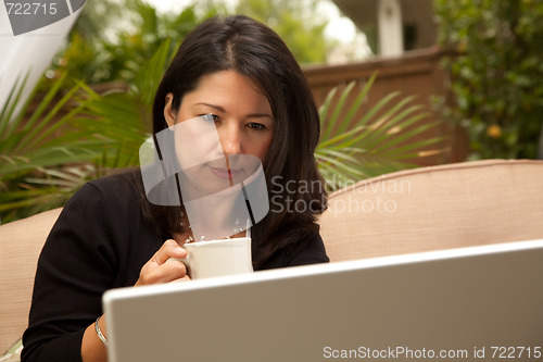 Image of Hispanic Woman with Coffee and Laptop