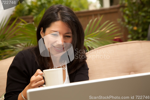 Image of Hispanic Woman with Coffee and Laptop