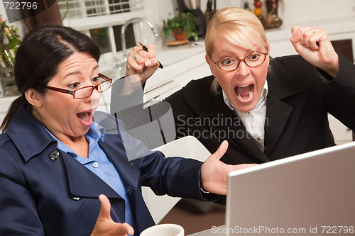 Image of Businesswomen Celebrate Success on the Laptop