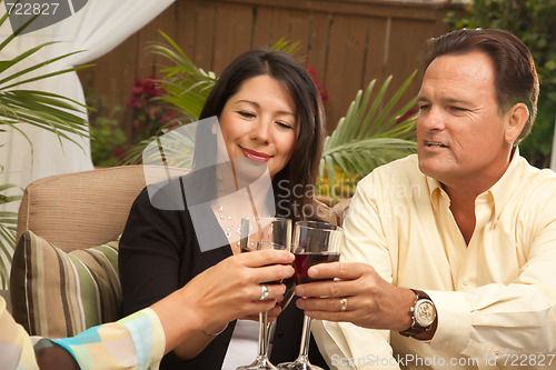 Image of Three Friends Enjoying Wine on the Patio