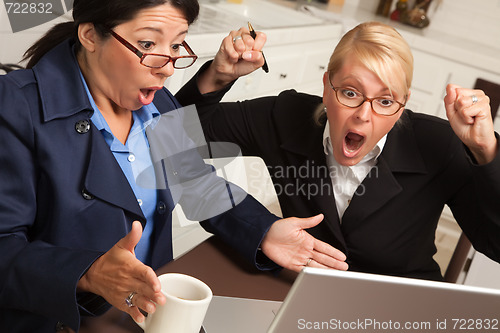 Image of Businesswomen Celebrate Success on the Laptop