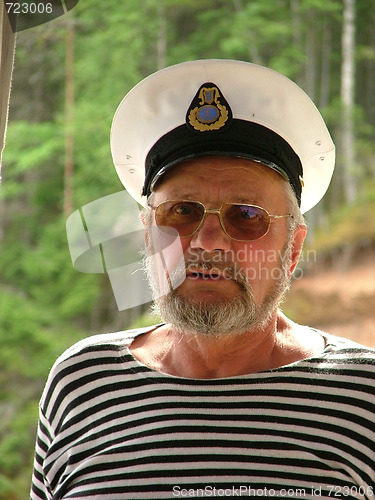Image of Old seaman with a white hat and stripy shirt