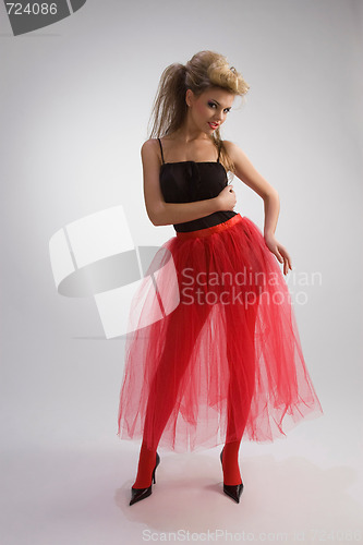 Image of Beautiful girl in red skirt