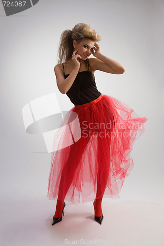 Image of Beautiful girl in red skirt