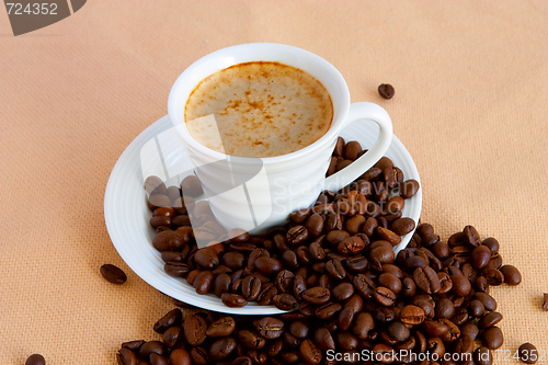 Image of  cup with coffee and grain