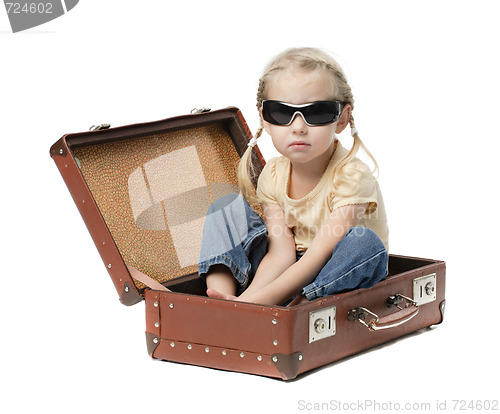 Image of little girl in suitcase