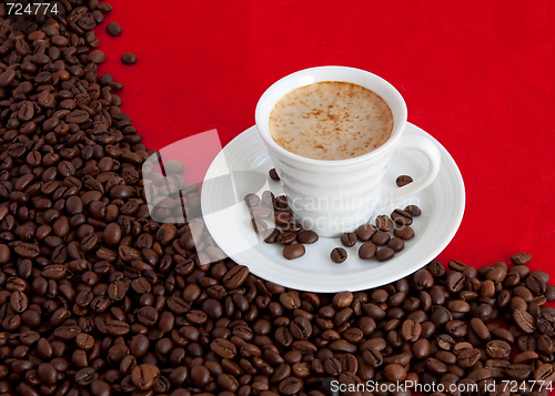 Image of cup with coffee and grain expressed on red background