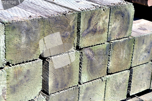 Image of Stack of wooden posts