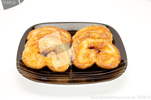 Image of cookies on a plate , isolated over white