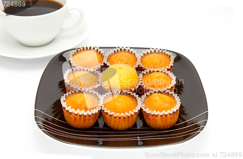 Image of cakes on a plate , isolated over white