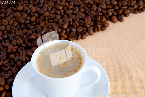 Image of  cup with coffee and grain