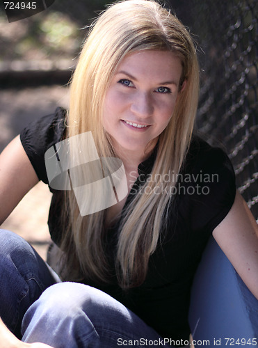 Image of Sitting on a Blue Bench