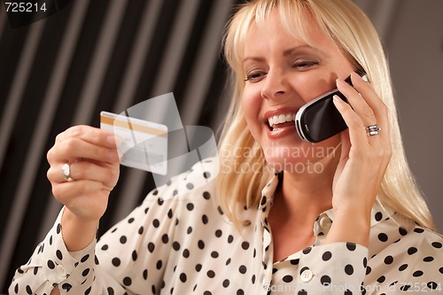 Image of Beautiful Woman on Phone Holding Credit Card