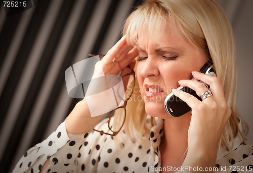 Image of Blonde Woman on Cell Phone with Stressed Look