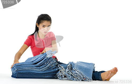 Image of woman with lots of jeans