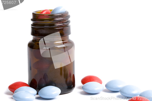 Image of bottle with red and blue pills