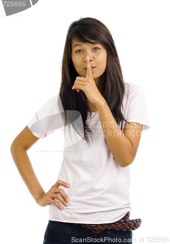 Image of woman with finger on her lips