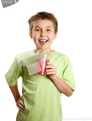 Image of Smiling boy holding a fresh berry fruit juice