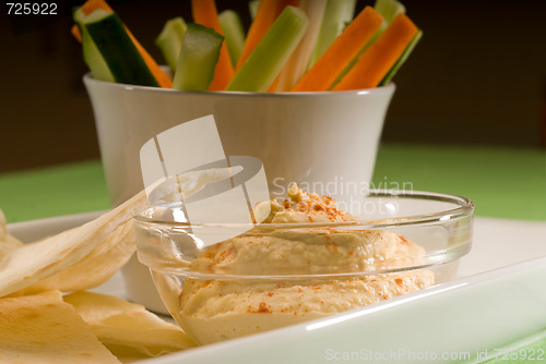 Image of hummus dip with pita brad and vegetable