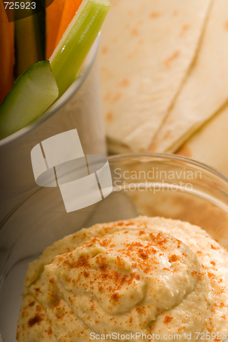 Image of hummus dip with pita brad and vegetable