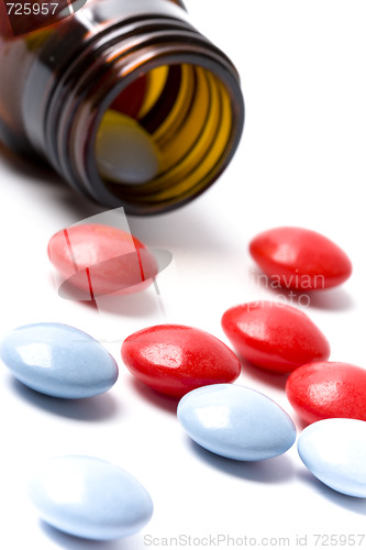 Image of bottle with red and blue pills