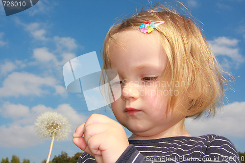 Image of girl and dandelion