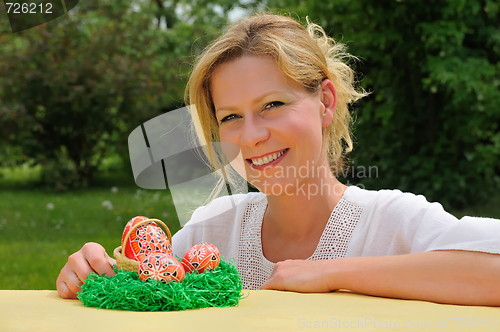 Image of Young woman and easter eggs