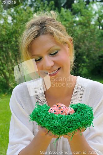 Image of Young woman and easter eggs