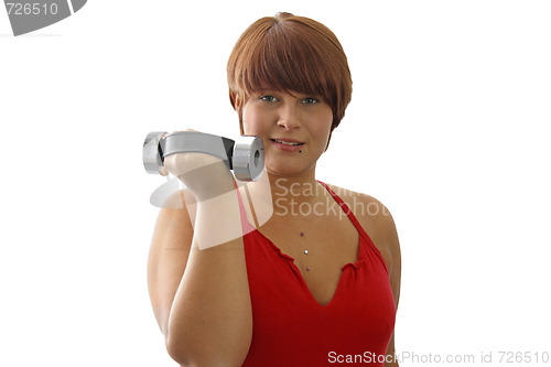 Image of Young woman with dumbbell