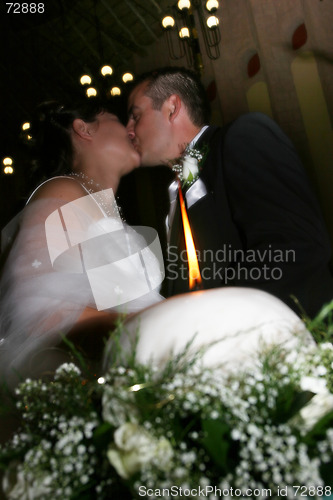 Image of Kissing Bride and Groom