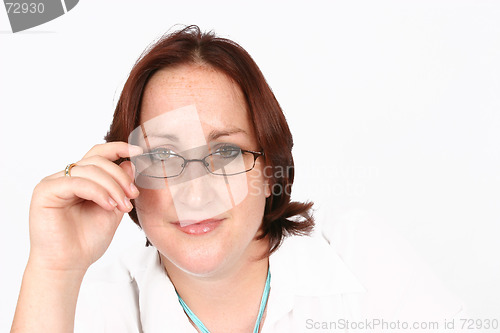 Image of Businesswoman holding her spectacles