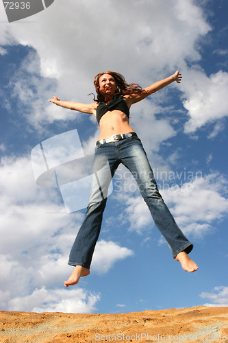 Image of Woman jumping of joy