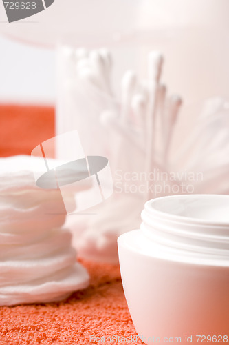 Image of facial cream and cotton pads