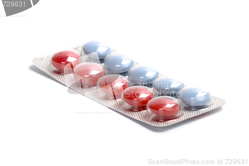 Image of red and blue pills in plastic blister