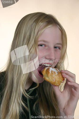 Image of Girl eating a cake