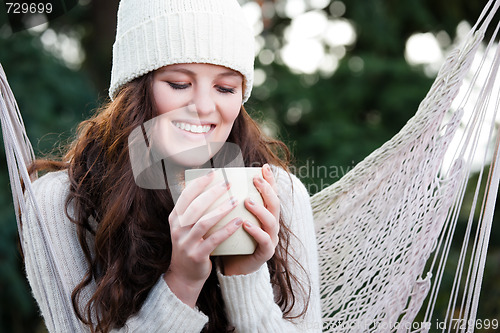 Image of Beautiful teenager drinking coffee