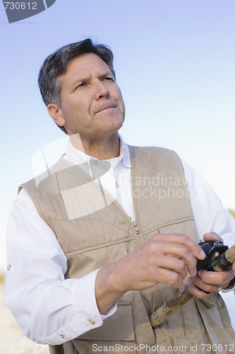 Image of Man Fishing in River