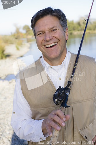 Image of Man With Fishing Pole