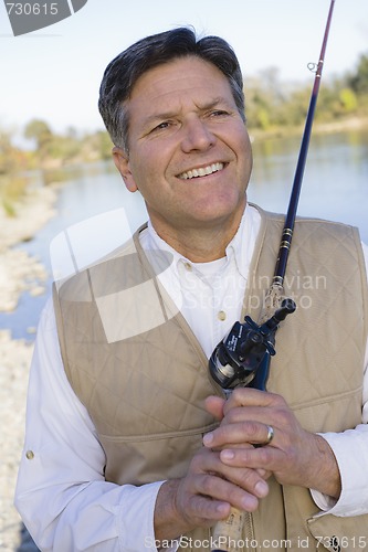 Image of Man With Fishing Pole